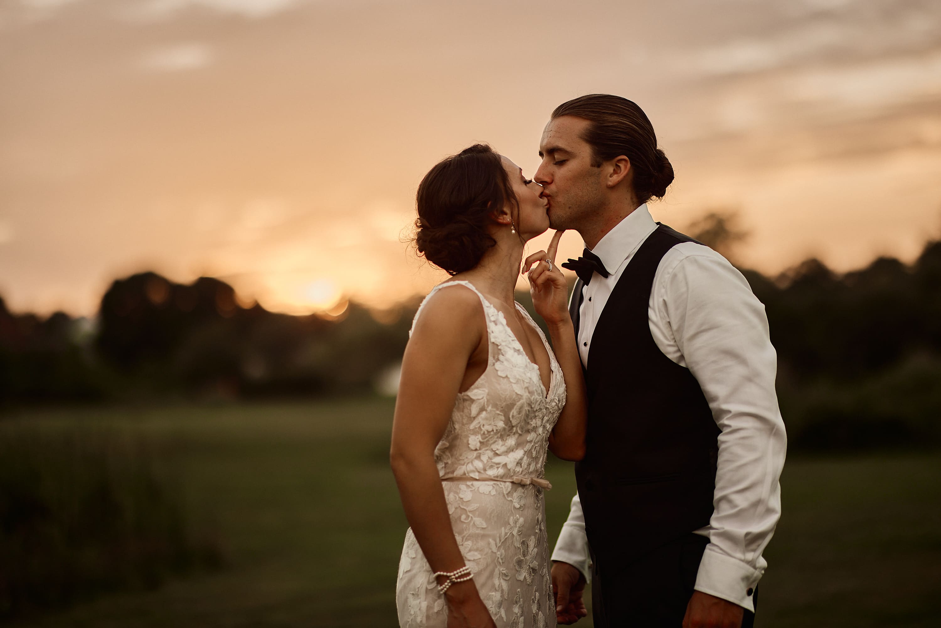 Sunset wedding portrait of a couple in a Massachusetts field